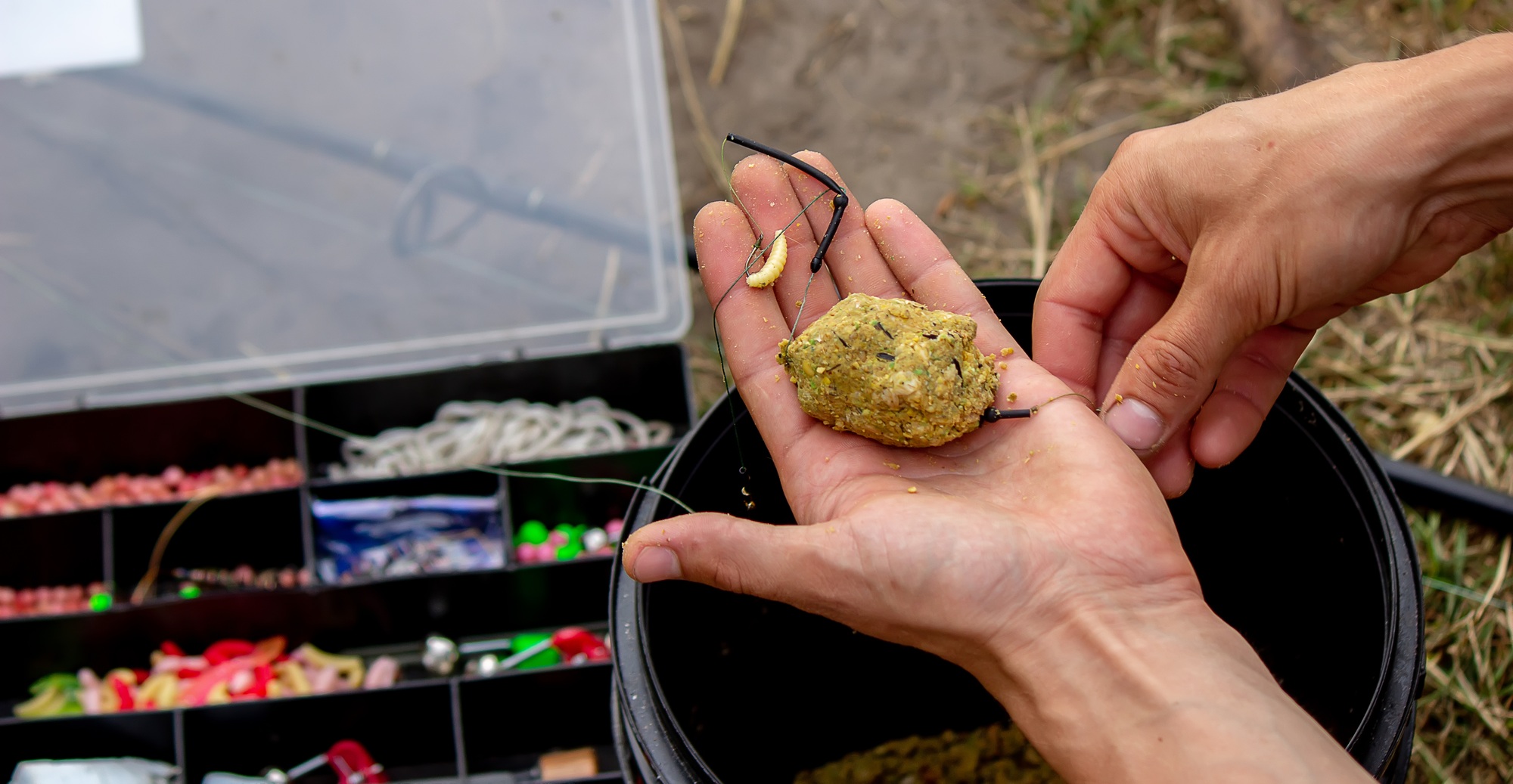 fishing tackle on a wooden float with mountain background and